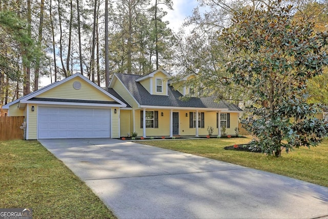 cape cod house with a front lawn and a garage