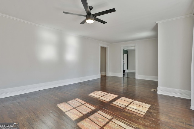 spare room with ceiling fan, dark hardwood / wood-style flooring, and crown molding