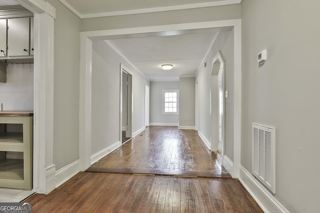 hall with ornamental molding, wine cooler, and hardwood / wood-style flooring