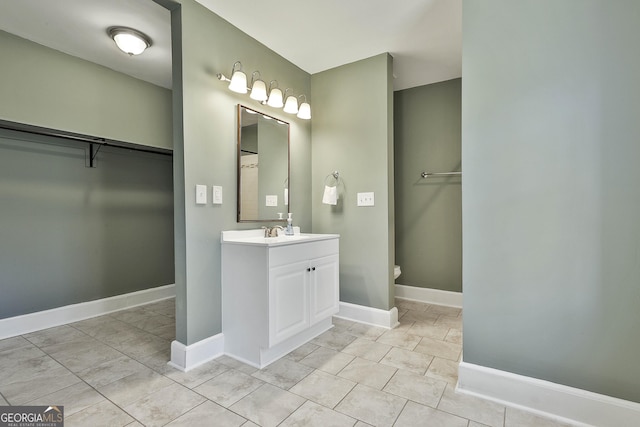 bathroom featuring tile patterned floors and vanity