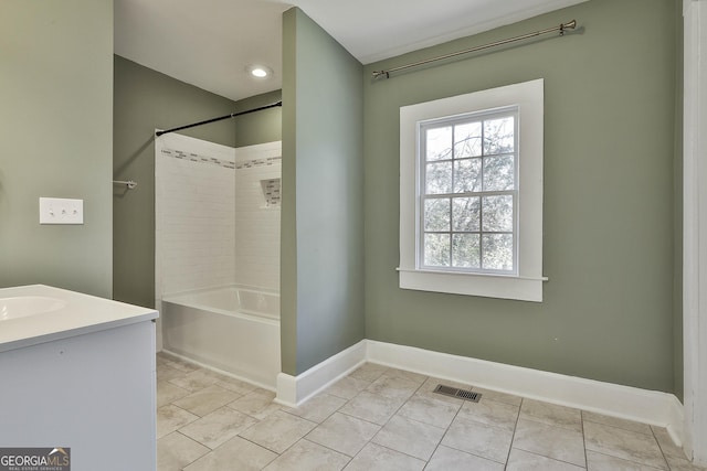 bathroom with vanity, tub / shower combination, and tile patterned floors