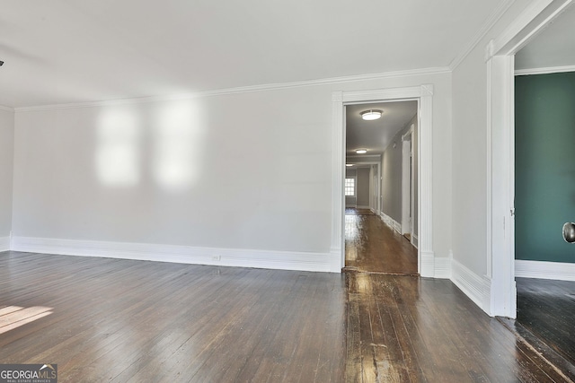 unfurnished room featuring dark hardwood / wood-style flooring and crown molding