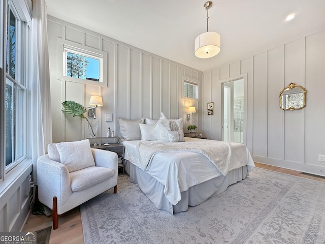 bedroom with hardwood / wood-style floors