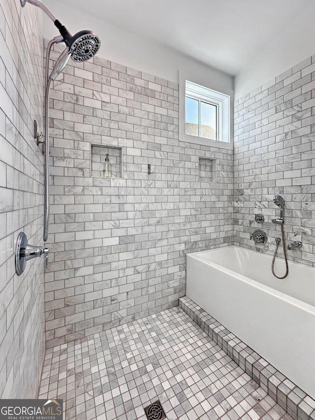 bathroom with a tile shower