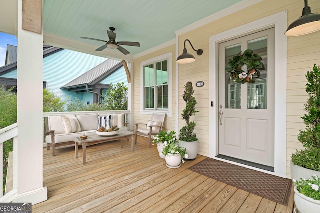 wooden deck with ceiling fan and a porch