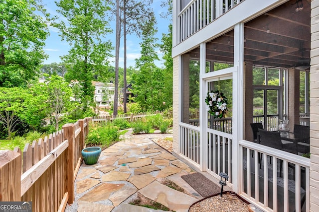 view of patio with a sunroom