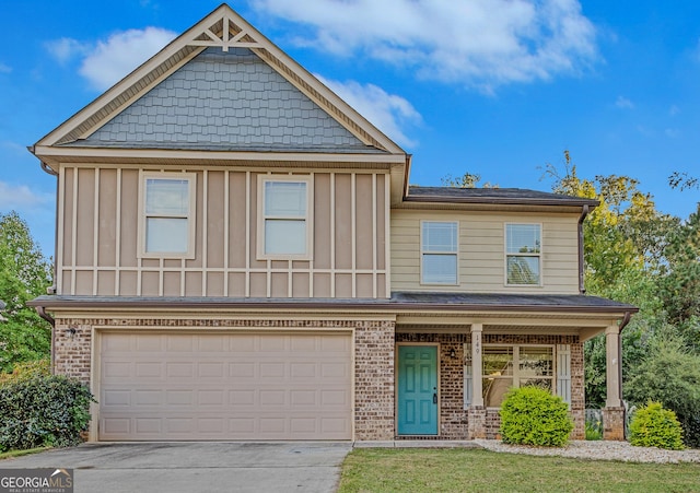 view of front of home featuring a garage and a porch