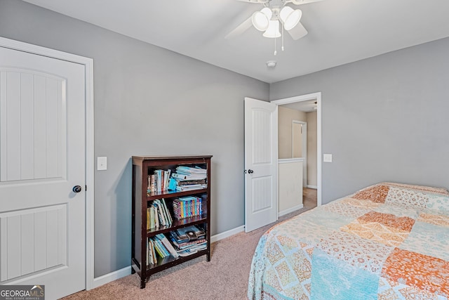 bedroom with light carpet and ceiling fan