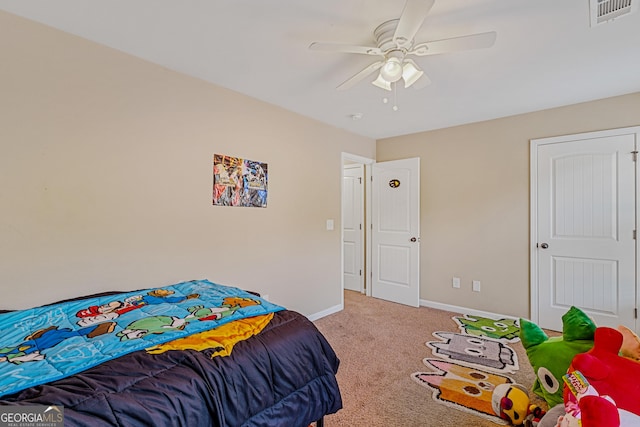 carpeted bedroom with ceiling fan