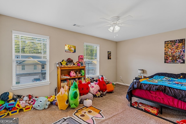 carpeted bedroom with ceiling fan