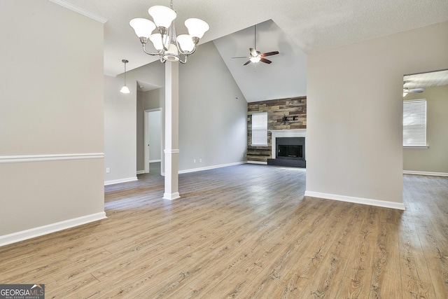 unfurnished living room featuring high vaulted ceiling, ceiling fan with notable chandelier, and light hardwood / wood-style flooring