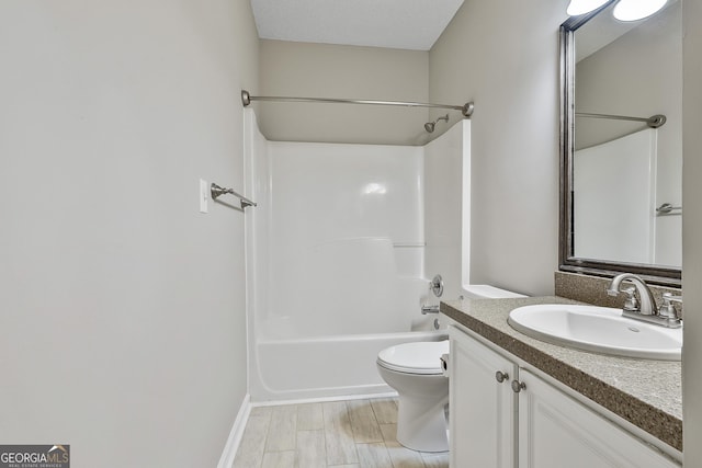 full bathroom with toilet, vanity, and shower / washtub combination