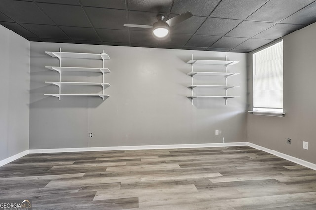 empty room featuring ceiling fan and hardwood / wood-style flooring