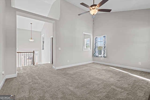 206 Glacier Ct, Carrollton, GA 30117 - spare room featuring high vaulted ceiling, a ceiling fan, healthy amount of natural light, carpet, and baseboards