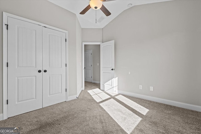 206 Glacier Ct, Carrollton, GA 30117 - unfurnished bedroom with carpet, vaulted ceiling, a closet, baseboards, and ceiling fan