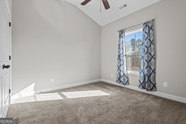 unfurnished room with carpet floors, lofted ceiling, visible vents, and baseboards