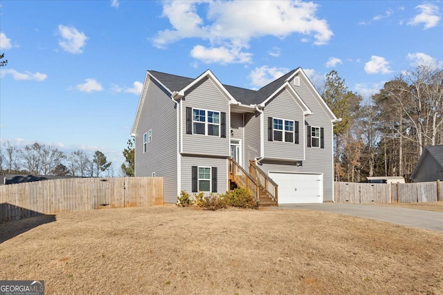 206 Glacier Ct, Carrollton, GA 30117 - view of front of property featuring concrete driveway, an attached garage, fence, a gate, and stairway