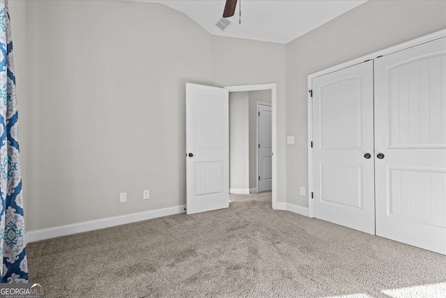 206 Glacier Ct, Carrollton, GA 30117 - unfurnished bedroom with carpet floors, a closet, baseboards, vaulted ceiling, and ceiling fan