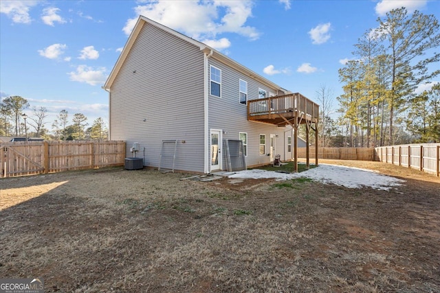 back of property with central AC, a fenced backyard, and a wooden deck