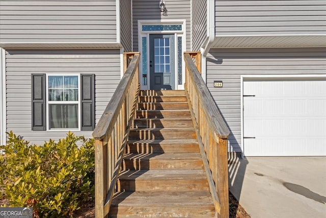 view of exterior entry with a garage