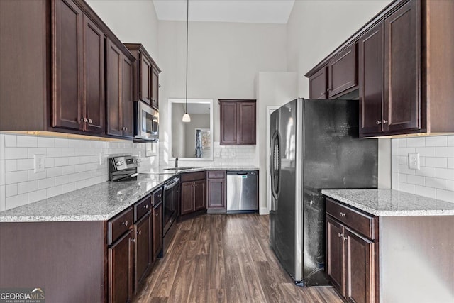 206 Glacier Ct, Carrollton, GA 30117 - kitchen featuring stainless steel appliances, backsplash, a sink, dark wood finished floors, and dark brown cabinetry