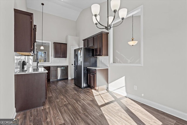 kitchen with dishwasher, hanging light fixtures, dark brown cabinets, and black fridge