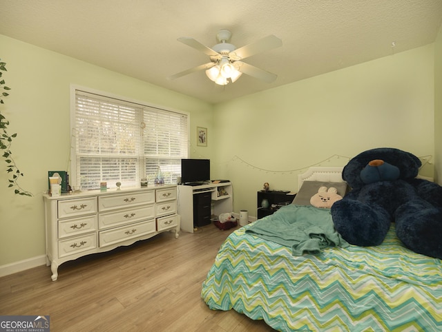 bedroom featuring ceiling fan and light hardwood / wood-style floors