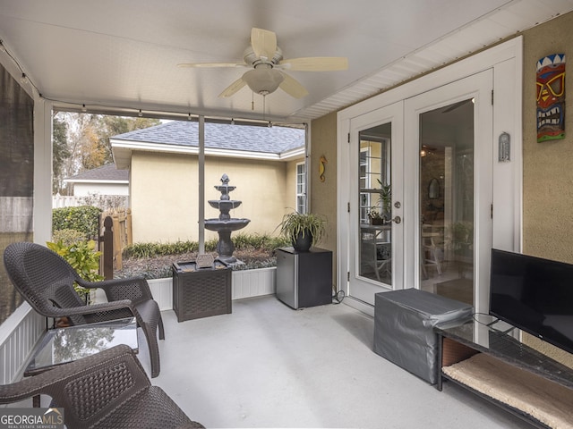 sunroom featuring ceiling fan, french doors, and a healthy amount of sunlight