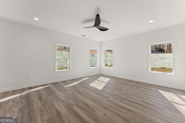 unfurnished room featuring recessed lighting, baseboards, wood finished floors, and ceiling fan