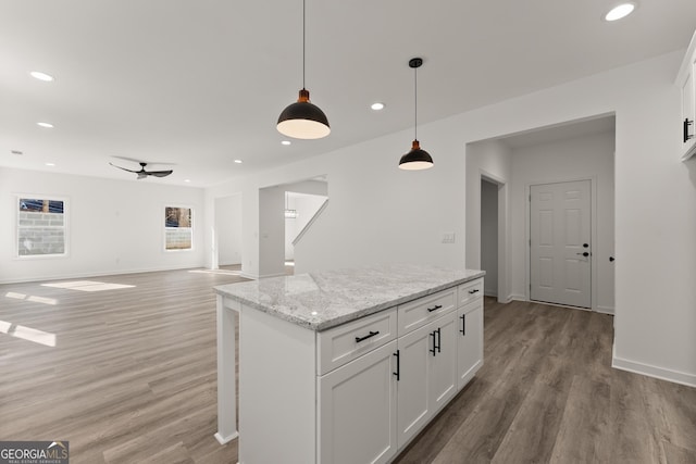 kitchen with pendant lighting, recessed lighting, light wood-style floors, and ceiling fan