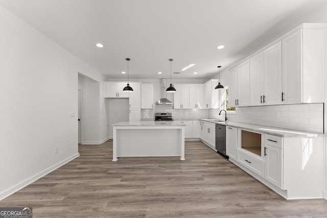 kitchen with backsplash, light wood-style flooring, white cabinets, and stainless steel appliances