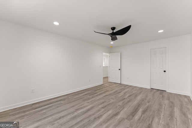 unfurnished bedroom featuring a ceiling fan, recessed lighting, wood finished floors, and baseboards