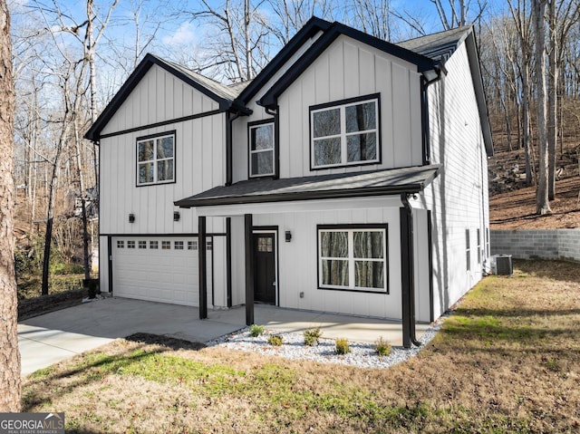 modern farmhouse style home featuring a garage, board and batten siding, central AC, and driveway