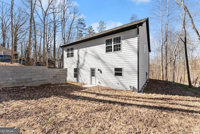 back of property with fence