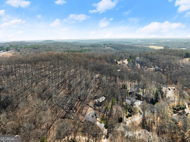 aerial view featuring a view of trees