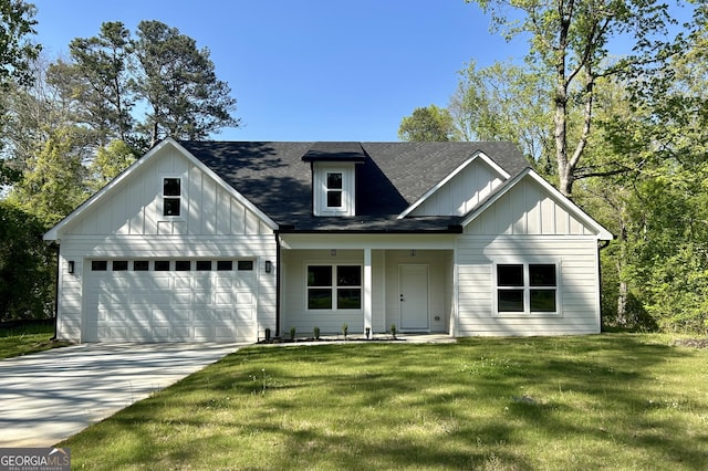 4392 Navajo Ln SE, Acworth, GA 30102 - view of front facade with concrete driveway, a garage, a shingled roof, board and batten siding, and a front yard