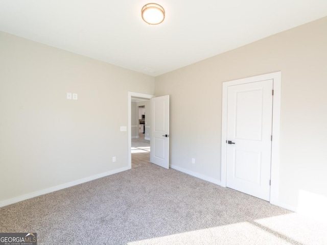 4392 Navajo Ln SE, Acworth, GA 30102 - unfurnished bedroom with baseboards and carpet