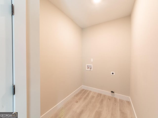 4392 Navajo Ln SE, Acworth, GA 30102 - laundry room with laundry area, baseboards, light wood-style flooring, electric dryer hookup, and washer hookup