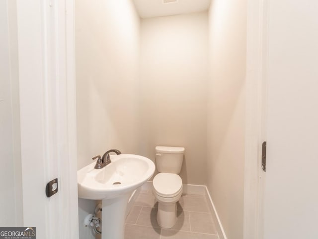 4392 Navajo Ln SE, Acworth, GA 30102 - half bathroom featuring visible vents, tile patterned flooring, baseboards, and toilet