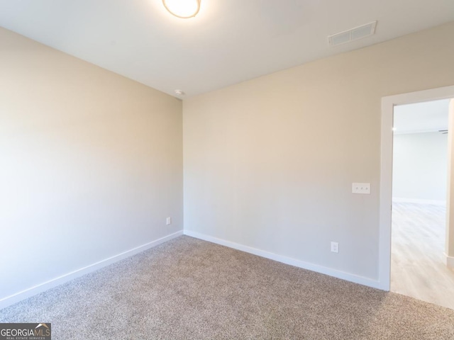 4392 Navajo Ln SE, Acworth, GA 30102 - unfurnished room featuring light colored carpet, baseboards, and visible vents