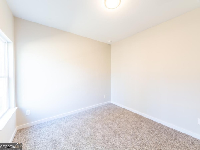 4392 Navajo Ln SE, Acworth, GA 30102 - spare room with a wealth of natural light, carpet flooring, and baseboards