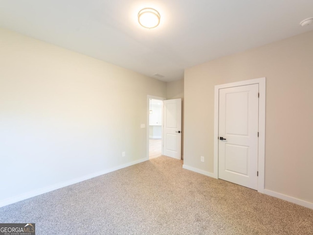 4392 Navajo Ln SE, Acworth, GA 30102 - unfurnished bedroom with light carpet and baseboards