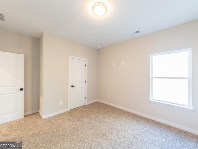 4392 Navajo Ln SE, Acworth, GA 30102 - unfurnished room with baseboards, visible vents, and light colored carpet