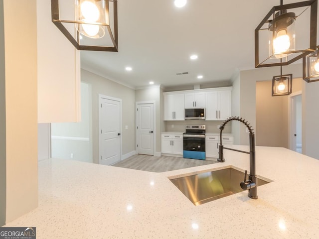 4392 Navajo Ln SE, Acworth, GA 30102 - kitchen featuring ornamental molding, a sink, light stone countertops, appliances with stainless steel finishes, and white cabinetry