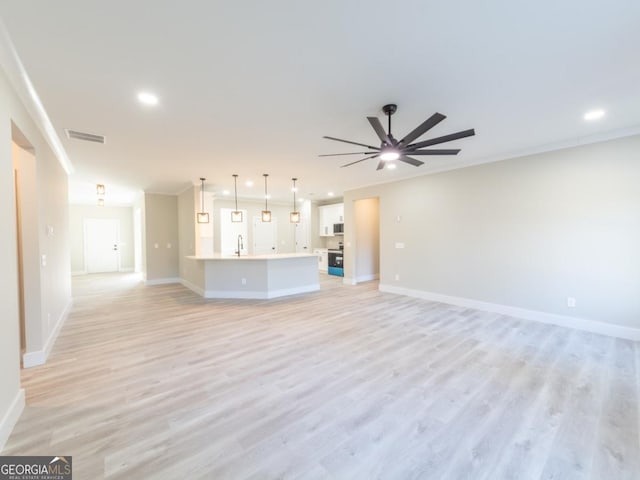 4392 Navajo Ln SE, Acworth, GA 30102 - unfurnished living room with visible vents, baseboards, a sink, and light wood-style floors