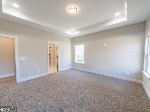 4392 Navajo Ln SE, Acworth, GA 30102 - carpeted spare room with baseboards, a tray ceiling, and recessed lighting
