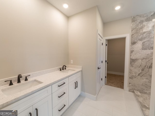 4392 Navajo Ln SE, Acworth, GA 30102 - full bathroom featuring tile patterned floors, baseboards, a sink, and double vanity