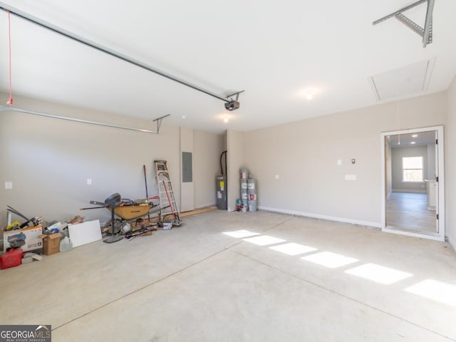 4392 Navajo Ln SE, Acworth, GA 30102 - garage featuring electric panel, electric water heater, strapped water heater, and a garage door opener