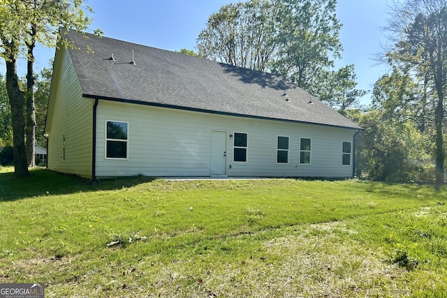 4392 Navajo Ln SE, Acworth, GA 30102 - back of house featuring a lawn and roof with shingles
