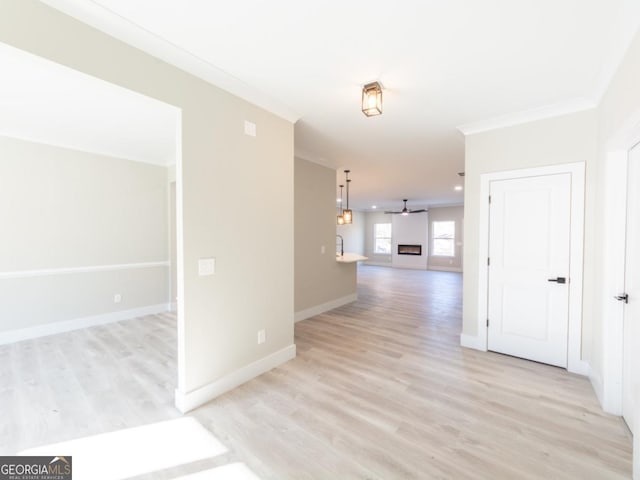 4392 Navajo Ln SE, Acworth, GA 30102 - unfurnished room with ceiling fan, baseboards, crown molding, and light wood-style flooring